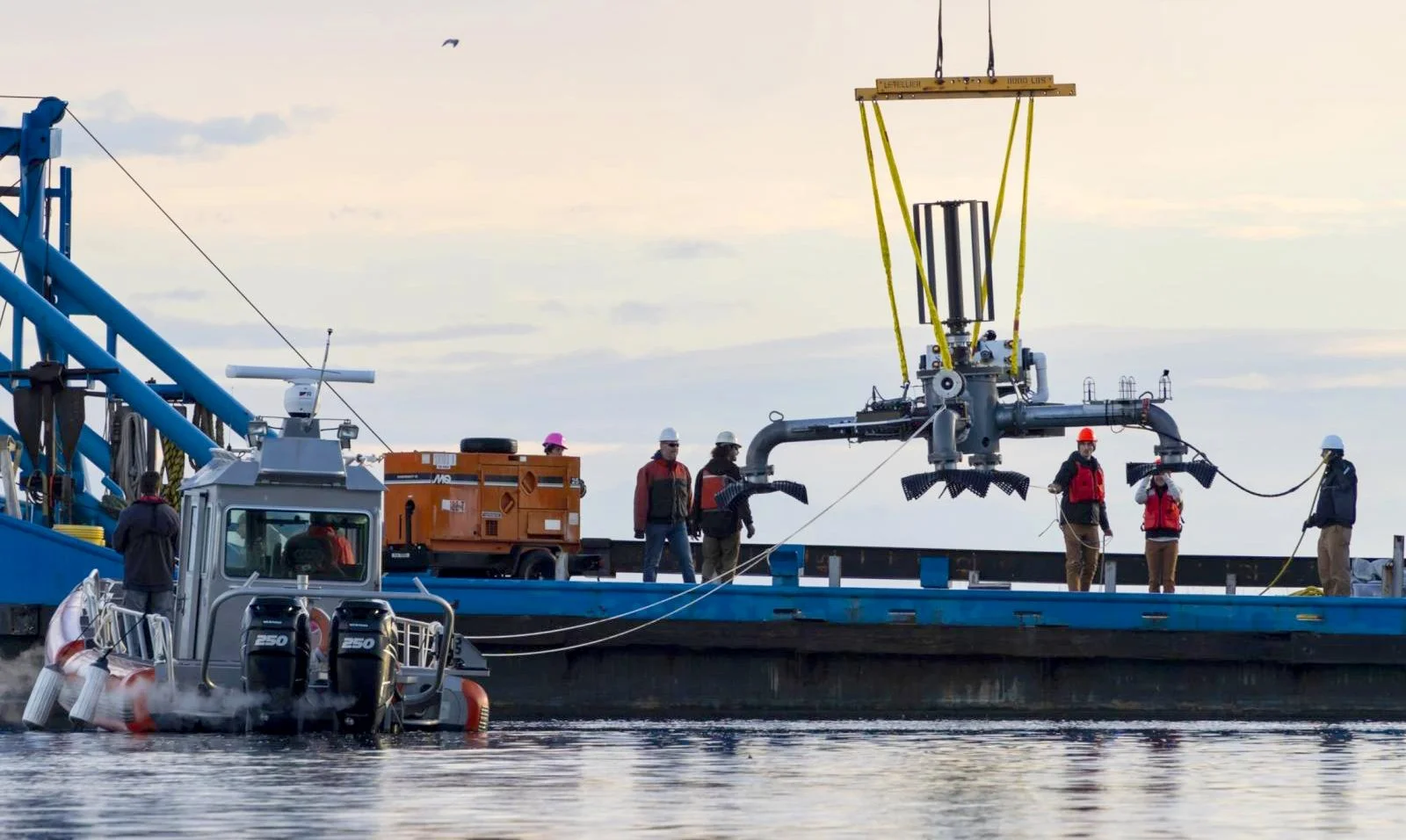 MarineSitu AMP being crane-deployed from a barge at a tidal energy site